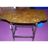 An early 20th century walnut shaped top bobbin turned side table, width 92cm