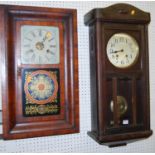 An early 20th century walnut drop trunk wall clock, with pendulum, together with an early 20th