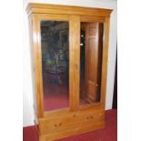 A late Victorian ash double mirrored door wardrobe, having single long lower drawer, width 126.