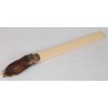 * A late Victorian ivory page turner, mounted with a taxidermy Badger (Meles meles) pad, the white