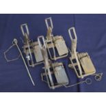 * A Sawyer RSPCA 9-coil spring rabbit trap; together with three other similar traps (4)Condition