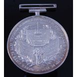 A Victorian white metal commemorative medal depicting three banners each with a motivational quote