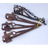 * An early 20th century steel 2 1/4" bow spring vermin trap, 21cm, together with three other similar