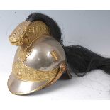 A French Model 1874 Cuirassier helmet, having a steel skull the high brass comb with black horsehair