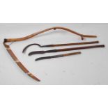 * An American Vestern two handled scythe, having an 88cm blade, 153cm, together with a briar hook,