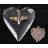 A WW II R.A.F. sweetheart heart shaped pendant, made of clear perspex with applied propeller and