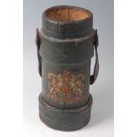 A WW I black painted canvas clad charge carrier with remains of printed Royal Coat of Arms and