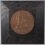 A WW I bronze memorial plaque, naming John Watson, mounted in an oak surround, 22 x 22cm.