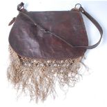 * A mid-20th century brown leather falconry bag with netting.Condition report: From ‘A Broad