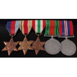 A WW II group of five medals to include 1939-45 Star, Africa Star, Italy Star, Defence and War. (5)
