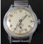 A WW II period gent's military issue steel cased wristwatch, having an unsigned silvered dial with