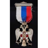 An English made silver and enamelled badge for the Russian Flag Day Movement, in the form of an