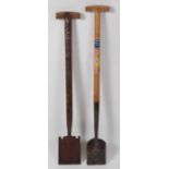 * A Griffin Trappers spade, having a riveted steel shaft and T handle, 89cm, together with a Skelton