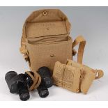 A pair of WW II Bausch & Lomb 6 x 30 military binoculars no. AA6527, in a canvas case dated 1942,