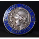 A London 1908 Olympic Games competitors medal in white metal and blue enamel, the pin back