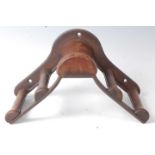 * An early 20th century Musgrave's Patent cast iron and mahogany bridle rack, marked Musgrave's