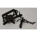 * A late 19th century Continental trap, having 7.5" square serrated jaws, with chain and drag (