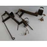 * A near-pair of late 19th / early 20th century rustic board-top style mole traps, 38cm (2)Condition