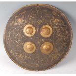 A 19th century Indian / Ottoman Dhal, of typical convex circular form with four raised gilt bosses