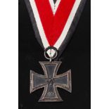 A German Third Reich Iron Cross 2nd class, on an associated ribbon, together with an associated