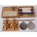 A group of four WW II medals to include 1939-1945 Star, France and Germany Star, Defence and War, in