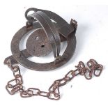 * An early 20th century steel pole trap, having 4" smooth jaws, unmarked.Condition report: From ‘A