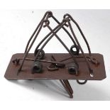 * An early 20th century iron double loop mole trap, possibly C. Homes, 12cm.Condition report: