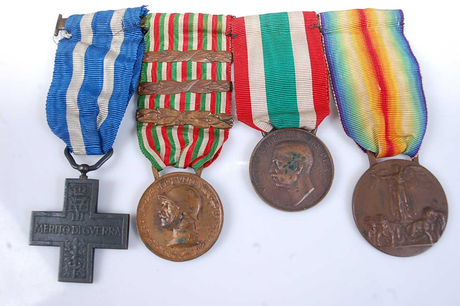 A WW I Italian medal group of four to include War Cross, War Medal with 1916,1917 and 1918 clasps,