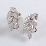 A pair of 18ct white gold diamond cluster earrings, each featuring six marquise shaped diamond