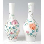 A pair of Chinese famille rose bottle vases, each enamel decorated with flowering bamboo and