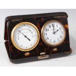 A George V tortoiseshell cased travelling clock barometer by Finnigans, the easel case opening to