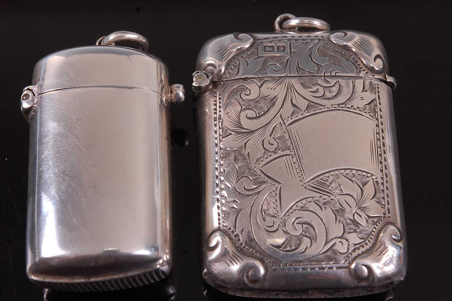 A late Victorian silver vesta, of plain undecorated rounded and rectangular form, maker George