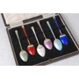 A cased set of six silver and guilloche enamel teaspoons, each enamelled in different colours, maker