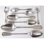 A late Georgian silver part cutlery suite, in the Fiddle & Shell pattern, comprising a pair of