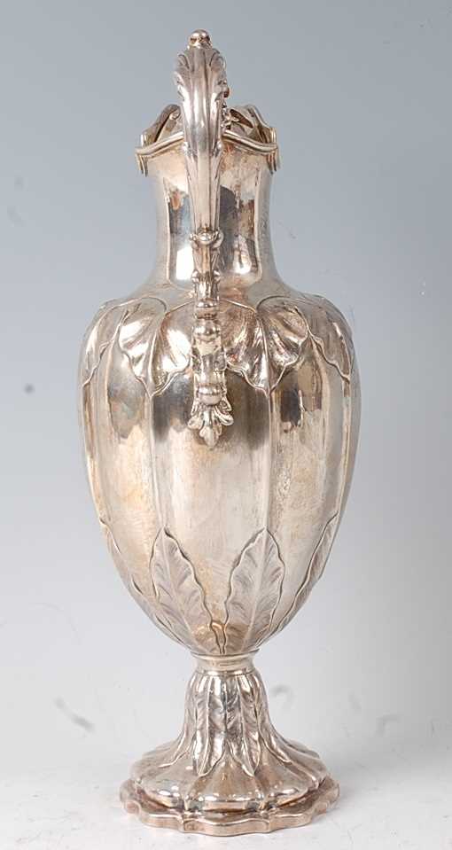 A Victorian silver claret jug, the lobed body with chased floral decoration, raised on a spreading - Image 5 of 5