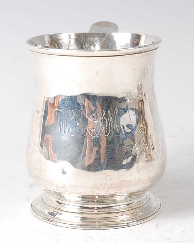 An early George II silver bell shaped small tankard, being later monogrammed, raised on an ogee - Image 4 of 4