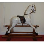Robert Mullis - a contemporary dapple-grey rocking horse on oak stand, with mane and tail, leather