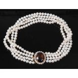 A four-row pearl choker, featuring four rows of 60, 57, 55 and 56 approx 5.1 to 5.3mm cultured