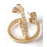 A pair of 18ct yellow gold diamond hoop earrings, each featuring 20 round brilliant cut diamonds, to
