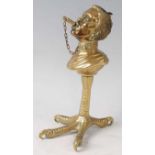 A late 19th century gilt bronze novelty table cigar lighter, the upper section modelled as a bust of