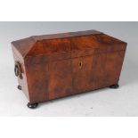 A large Regency yew wood tea caddy, of sarcophagus form, the hinge cover enclosing twin lidded