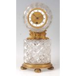 A mid-19th century French Baccarat type cut glass and gilt bronze mantel clock, of unusual