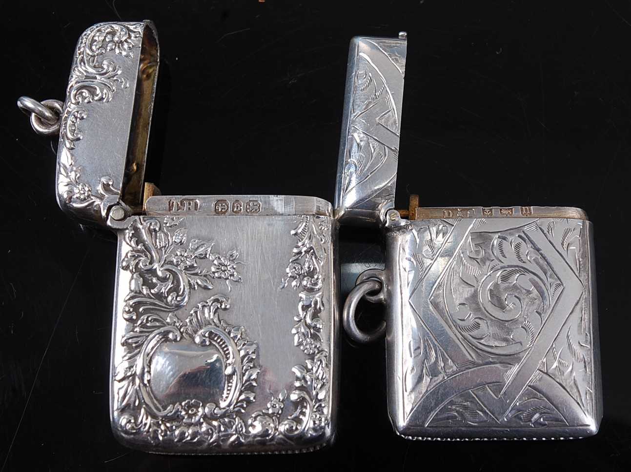 A late Victorian silver vesta, of hinged rectangular form, relief decorated with flowers and C- - Image 2 of 2