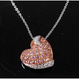 A white and rose metal, pink sapphire and diamond abstract heart pendant, attached to a fine trace