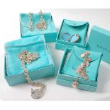 A selection of four boxed pieces of Tiffany jewellery, comprising a silver oval link necklet with