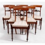 A set of six William IV rosewood dining chairs, each having a barback above a drop-in seat, on tulip