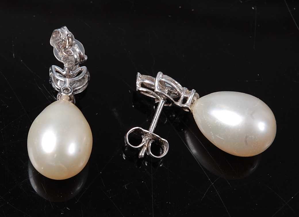 A pair of white metal, pearl and diamond drop earrings, the earrings each featuring a pearl drop - Image 2 of 2