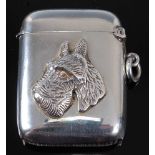 An Edwardian silver vesta, of hinged rectangular form, relief decorated with bust of a West Highland