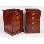 A pair of mahogany bedside chests, each having rectangular top above four long graduated drawers