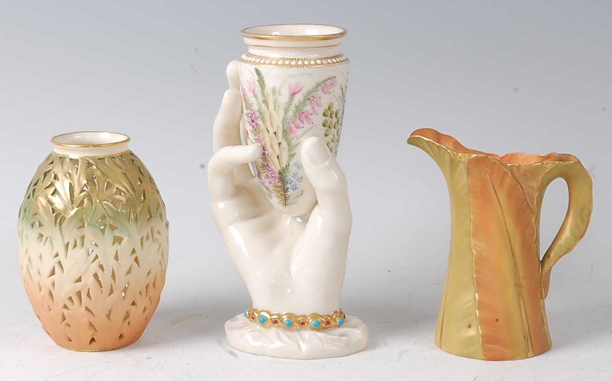 A Worcester porcelain hand-held vase, of conical form, the vase decorated with wildflowers, the hand